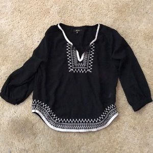 Black shirt with white stitching